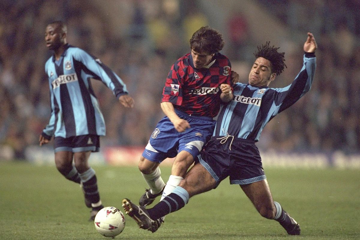 Richard Shaw (right) of Coventry tackles Gianfranco Zola of Chelsea during the Premier League match at Highfield Road in Coventry, England.