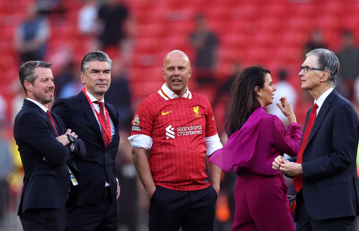 Arne Slot, Manger of Liverpool, speaks to the Liverpool owners after the teams victory and confirmation of winning the Premier League title in the Premier League match between Liverpool FC and Tottenham Hotspur FC at Anfield on April 27, 2025 in Liverpool, England