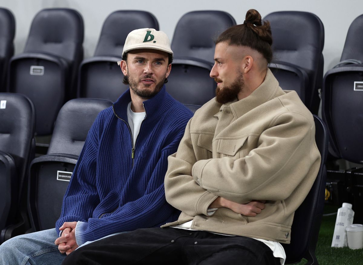 James Maddison & Radu Dragusin of Tottenham Hotspur watch on from the stands during the UEFA Champions League 2025/26 League Phase MD1 match between Tottenham Hotspur and Villarreal CF at Tottenham Hotspur Stadium on September 16, 2025 in London, England