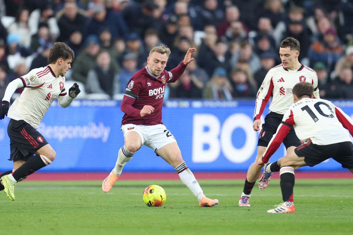 West Ham United's Jarrod Bowen in between Liverpool's Milos Kerkez, Alexis Mac Allister and Florian Wirtz during the Premier League match between West Ham United and Liverpool at London Stadium on November 30, 2025 in London, England