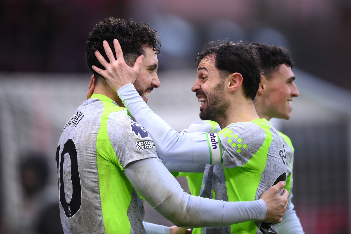 Rayan Cherki of Manchester City celebrates scoring his team's second goal with Bernardo Silva during the Premier League match between Nottingham Forest and Manchester City