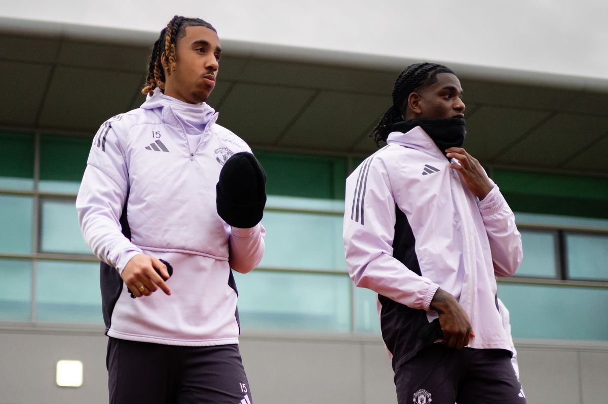 Leny Yoro and Ayden Heaven of Manchester United in action during a first team training session at Carrington Training Ground 