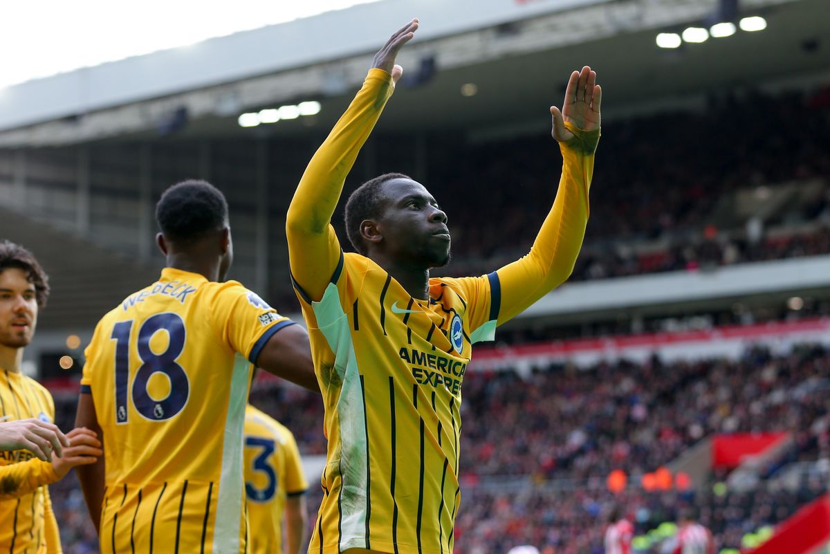 Yankuba Minteh celebrates a Brighton goal