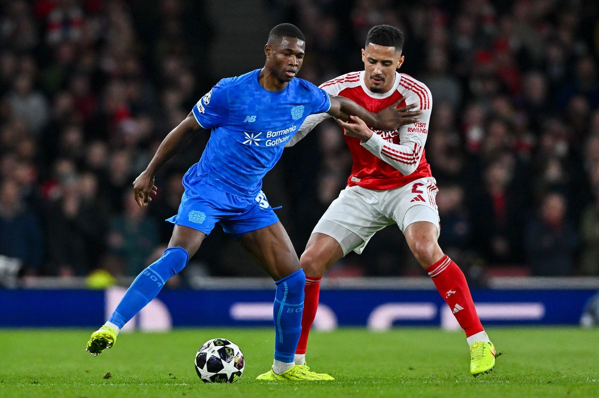 London, United Kingdom - March 17: Christian Kofane of Bayer 04 Leverkusen and William Saliba of Arsenal FC battle for the ball during the UEFA Champions League 2025/26 Round of 16 Second Leg match between Arsenal FC and Bayer 04 Leverkusen at Arsenal Stadium on March 17, 2026 in London, United Kingdom. (Photo by Vince Mignott/DeFodi Images/DeFodi via Getty Images)