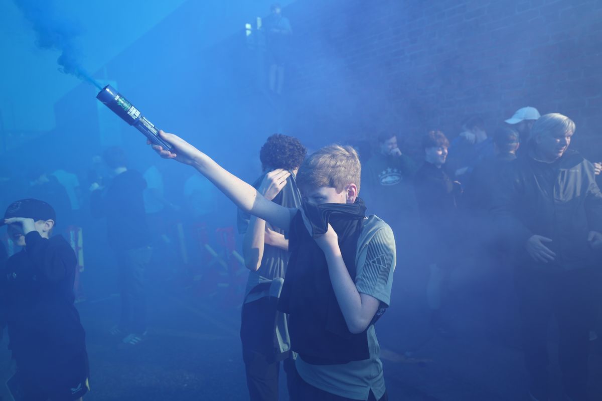 Fans set off smoke flares as they enjoy the pre-match atmosphere outside the stadium prior to the Premier League match between Everton and Chelsea at Hill Dickinson Stadium. Photo by Alex Livesey/Getty Images