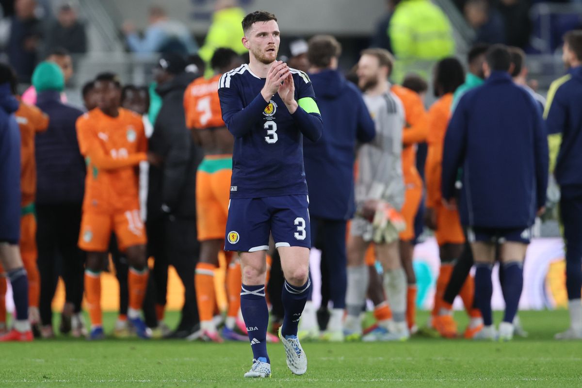 Andy Robertson applauds the fans after Scotland's defeat to Ivory Coast