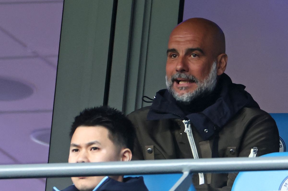 Manchester City's manager Pep Guardiola looks on from his seat