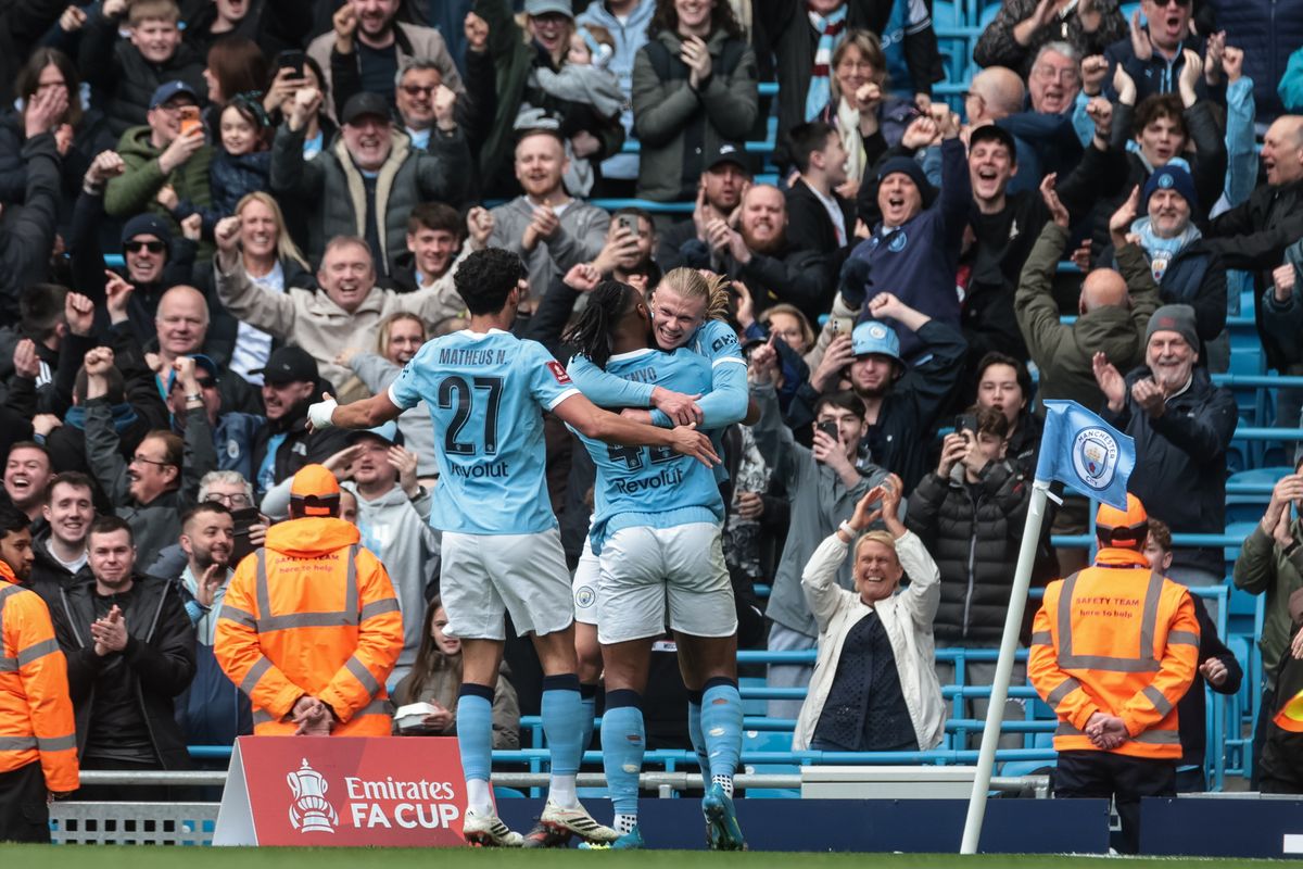 Manchester City players celebrate during their 4-0 FA Cup victory over Liverpool on Saturday