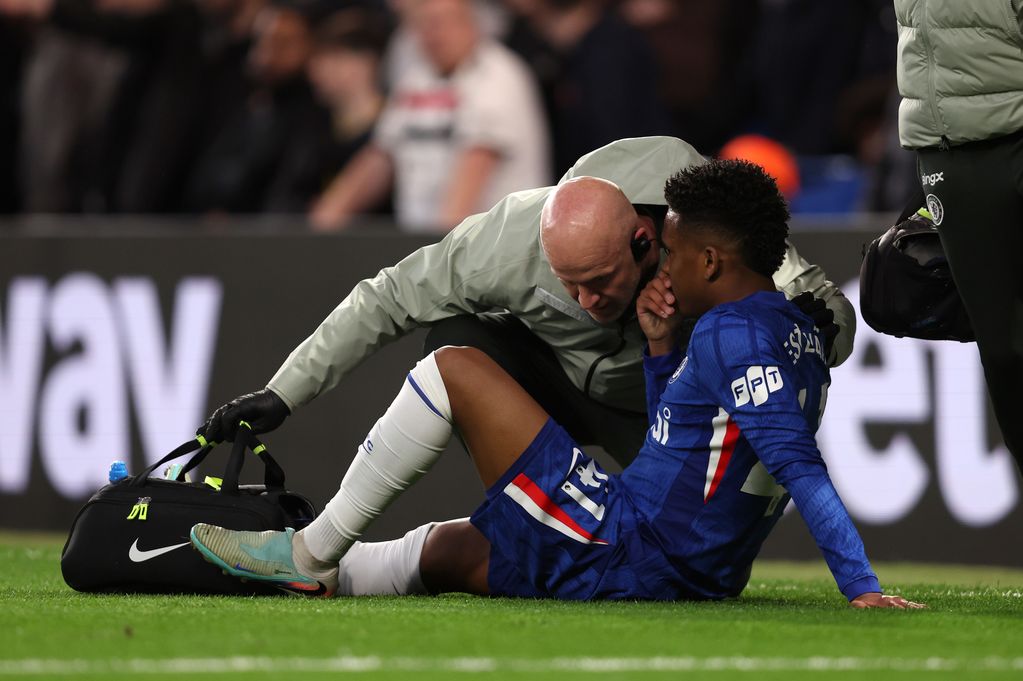 Estevao of Chelsea receives treatment during the Premier League match between Chelsea and Manchester United at Stamford Bridge on April 18, 2026 in London, United Kingdom