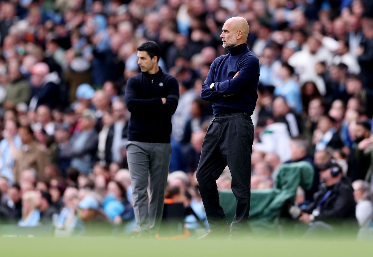 Pep Guardiola of Manchester City looks on