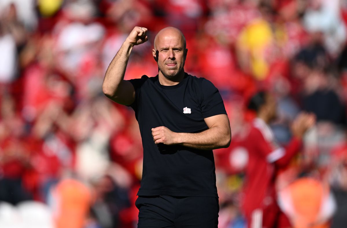 Arne Slot celebrates with his fist pumped in the air