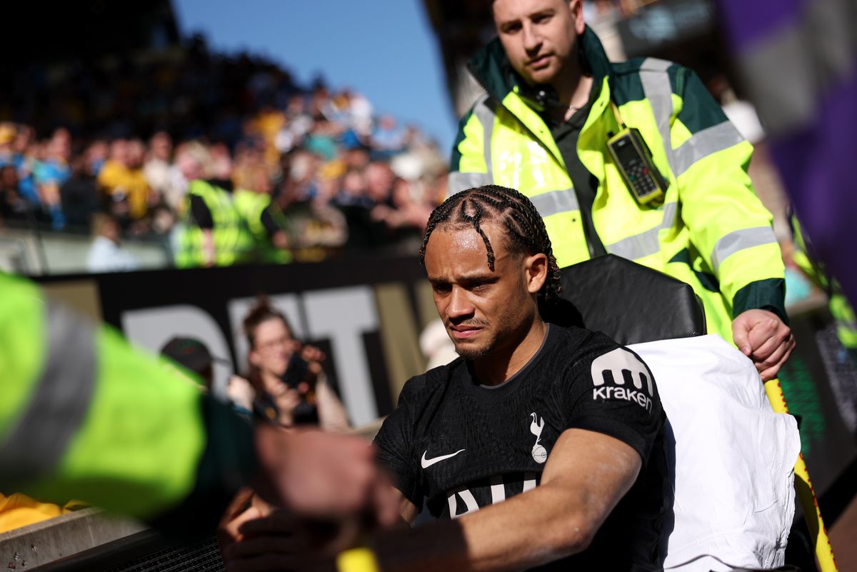 Xavi Simons of Tottenham Hotspur reacts as he is stretchered off after picking up an injury during the Premier League match between Wolverhampton Wanderers and Tottenham Hotspur at Molineux on April 25, 2026 in Wolverhampton, England.