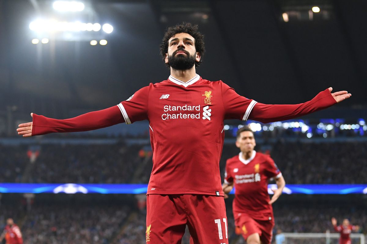 MANCHESTER, ENGLAND - APRIL 10:  Mohamed Salah of Liverpool celebrates after scoring his sides first goal during the UEFA Champions League Quarter Final Second Leg match between Manchester City and Liverpool at Etihad Stadium on April 10, 2018 in Manchester, England.  (Photo by Laurence Griffiths/Getty Images,)