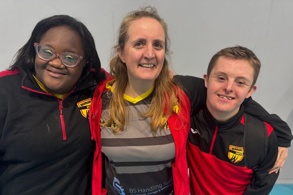 A volunteer, organiser and attendee of Warriors United pictured together with their kits on.