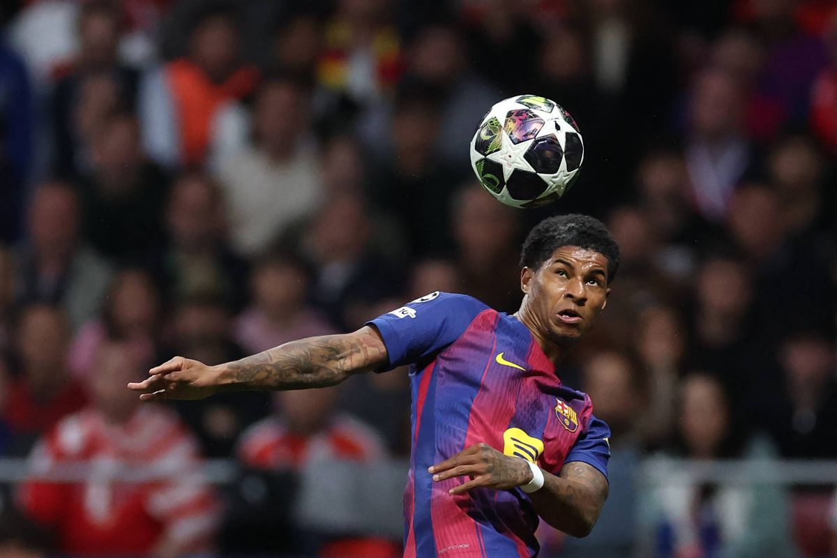 Marcus Rashford heads a ball for Barcelona