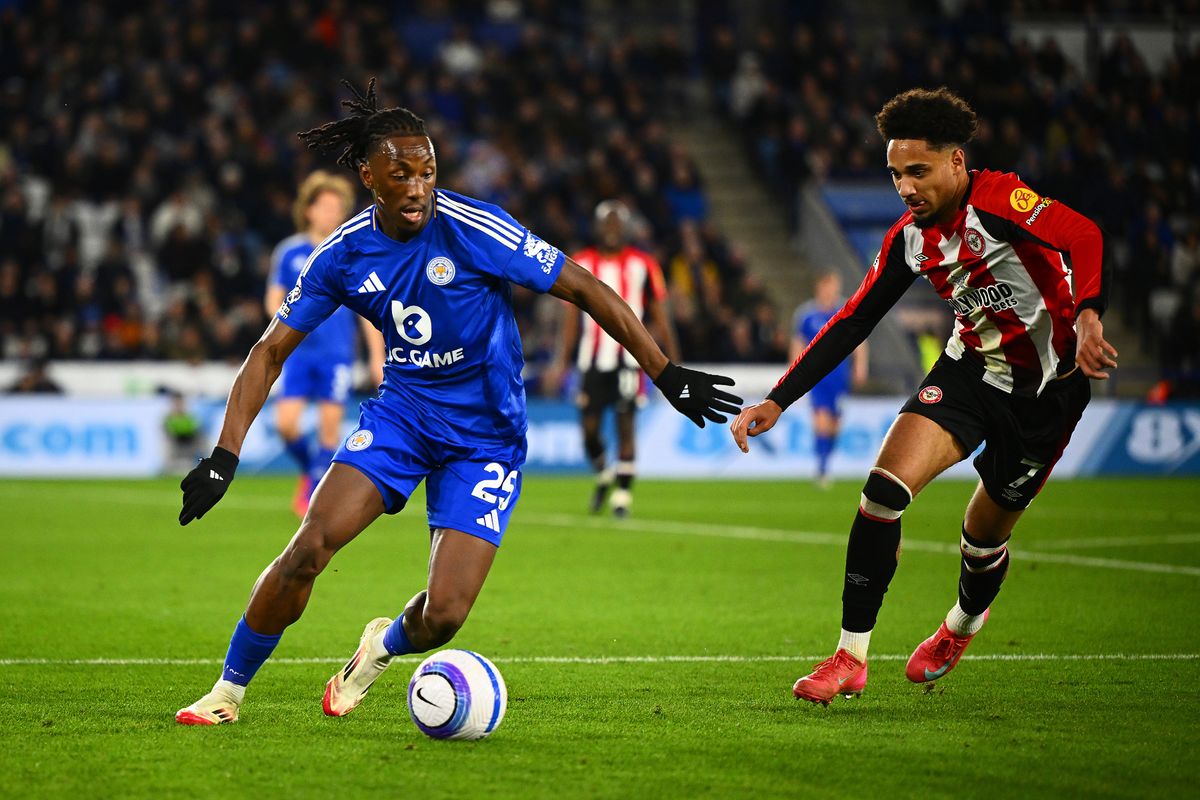 Woyo Coulibaly of Leicester City runs with the ball whilst under pressure from Kevin Schade of Brentford