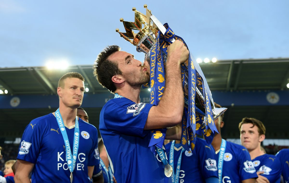 Christian Fuchs of Leicester City kisses the Premier League Trophy 