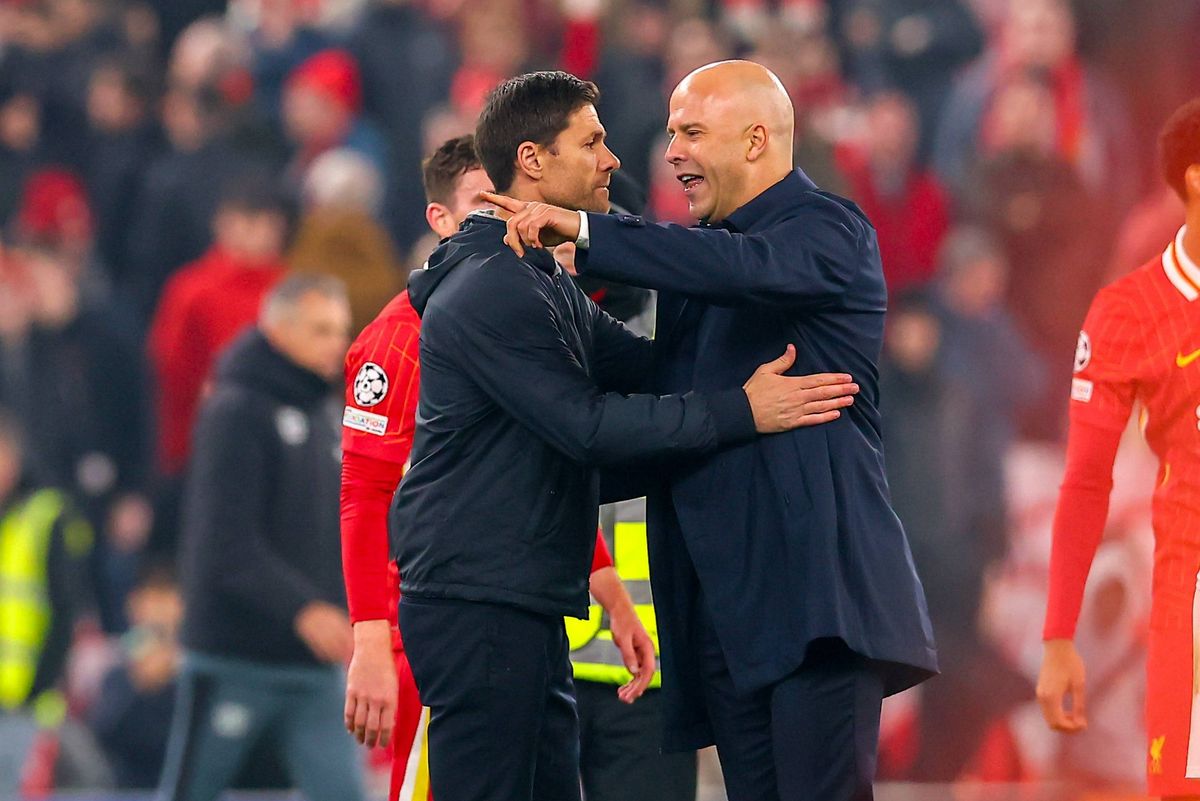 Liverpool, England - November 5: Bayer 04 Leverkusen manager Xabi Alonso and Liverpool manager Arne Slot speak at full time during the UEFA Champions League 2024/25 League Phase MD4 match between Liverpool FC and Bayer 04 Leverkusen at Anfield on November 5, 2024 in Liverpool, England. (Photo by Ryan Crockett/DeFodi Images via Getty Images) 
