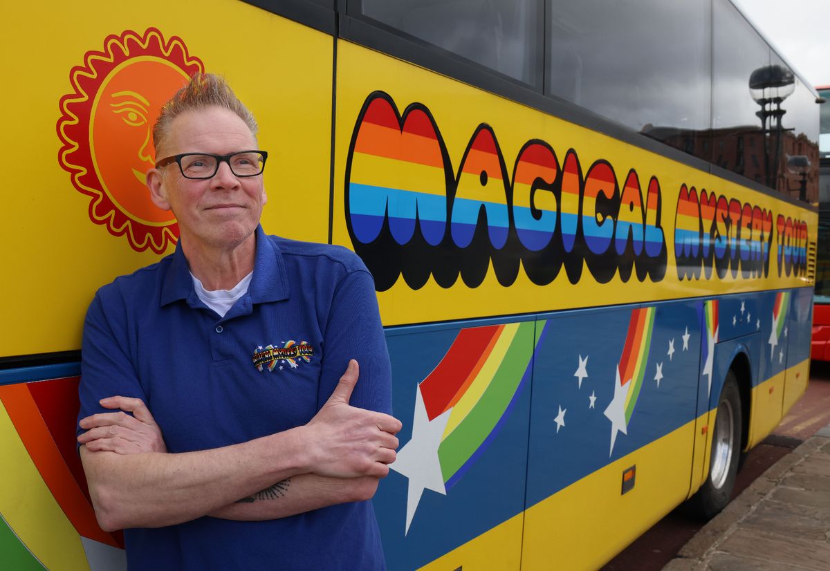 Magical Mystery tour guide Del Pike with the Magical Mystery Tour bus