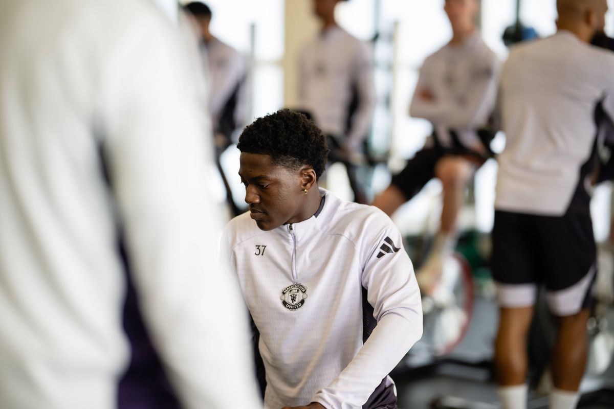 Kobbie Mainoo of Manchester United in action during a first team training session