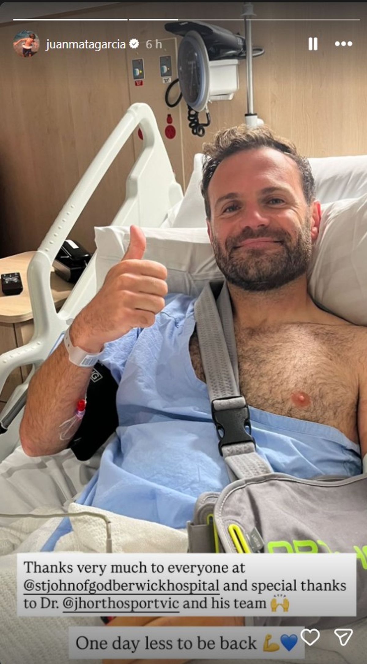 Juan Mata in a hospital bed with his left arm in a sling