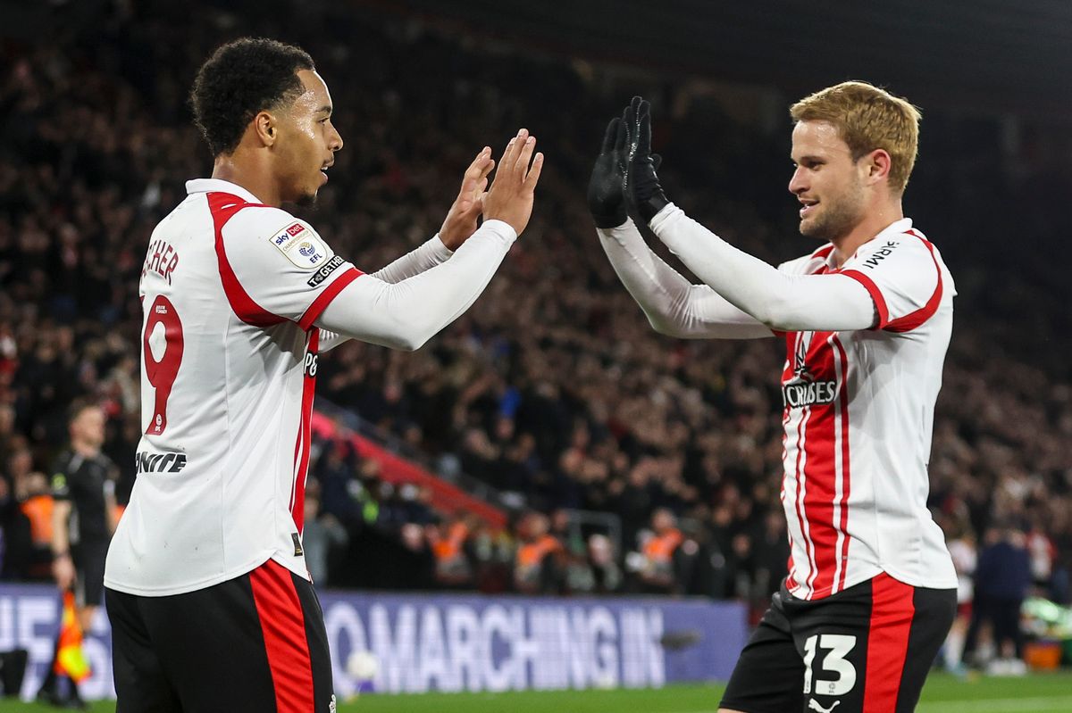 Cameron Archer of Southampton celebrates with Leo Scienza after scoring their third against Blackburn