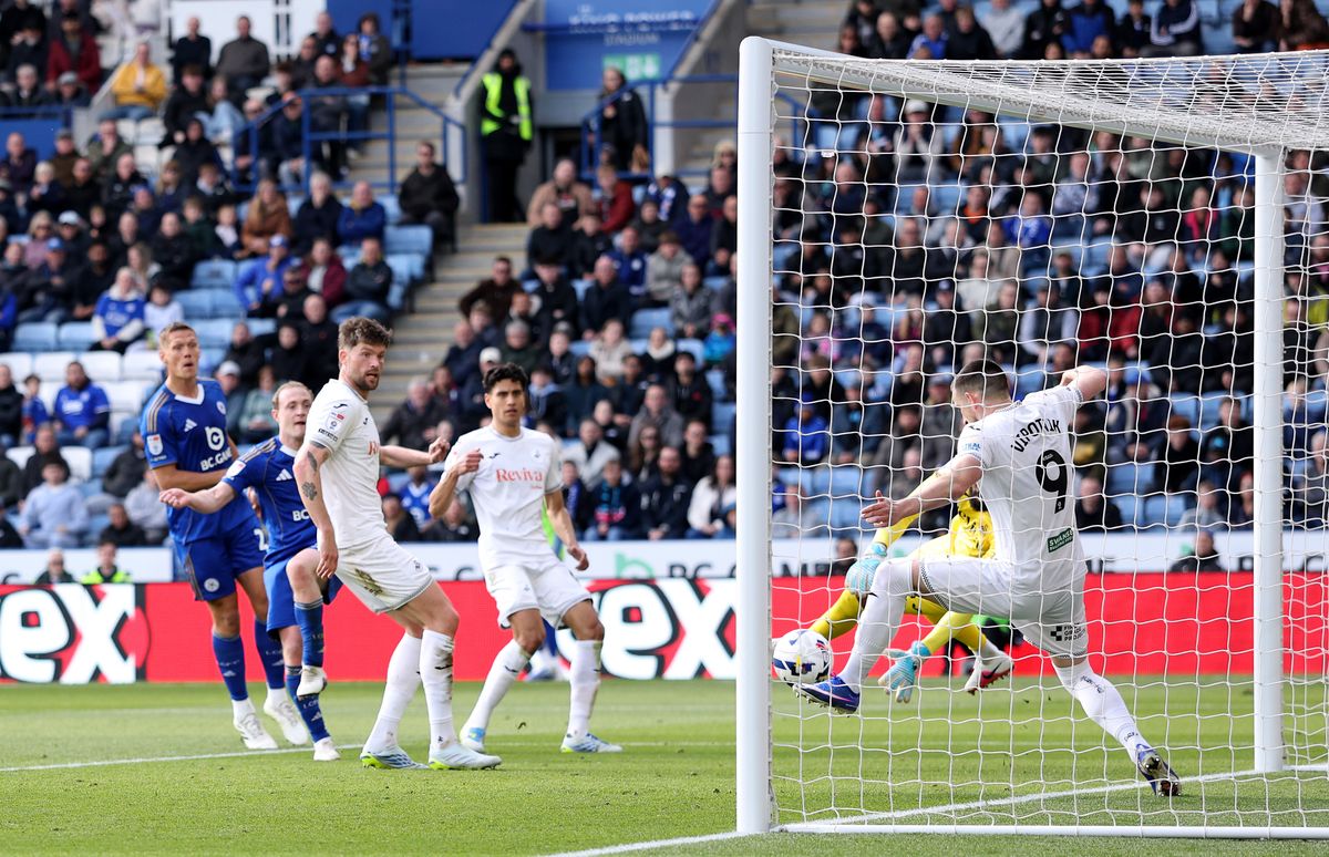  Zan Vipotnik of Swansea City clears a shot off the line from Oliver Skipp of Leicester City