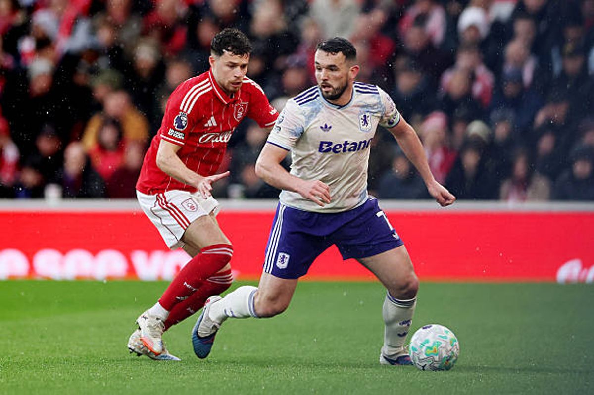 John McGinn of Aston Villa is challenged by Neco Williams of Nottingham Forest during the Premier League match between Nottingham Forest and Aston Villa at City Ground on April 12, 2026 in Nottingham, England.