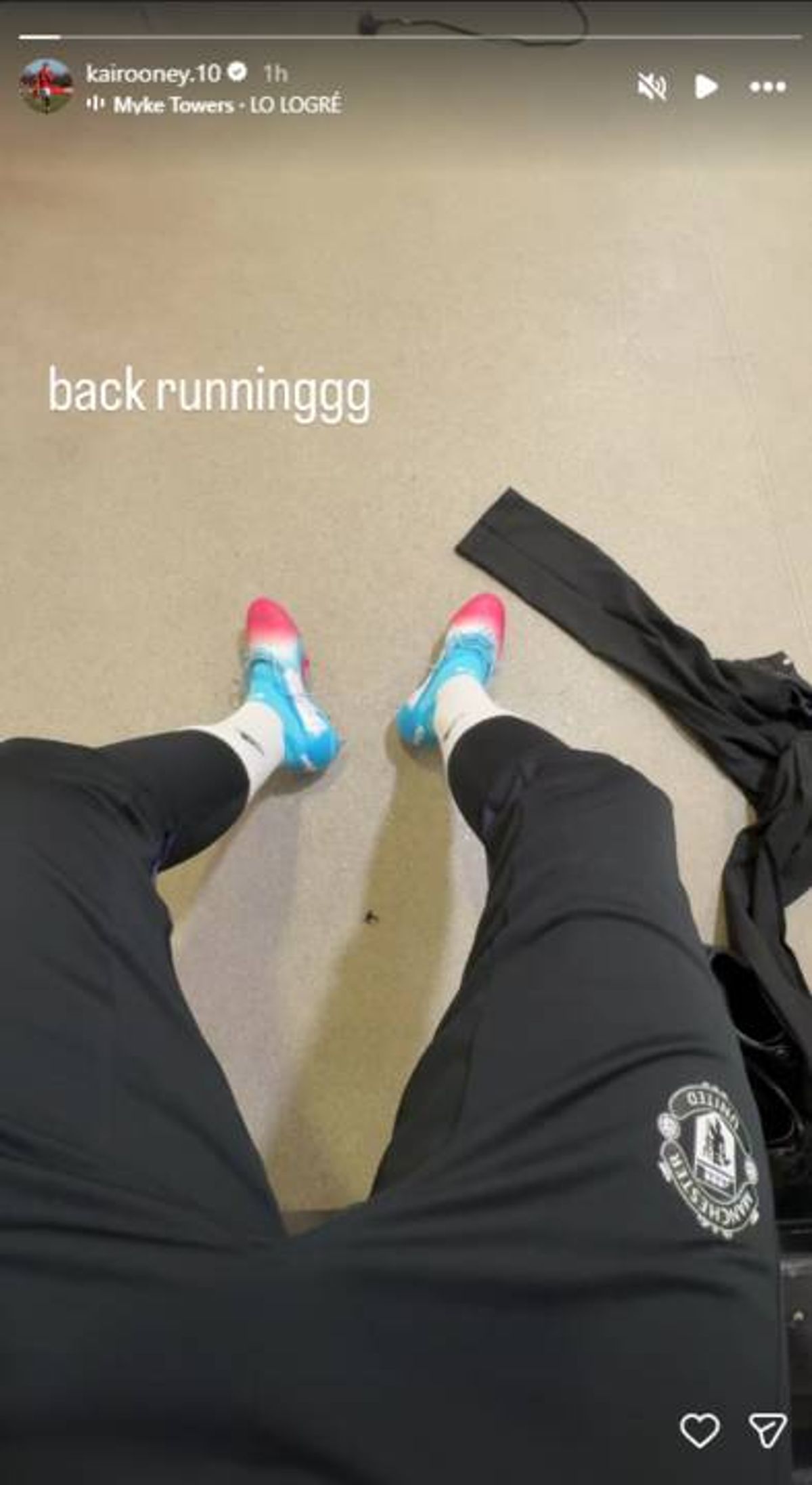 Kai Rooney wearing Manchester United tracksuit bottoms