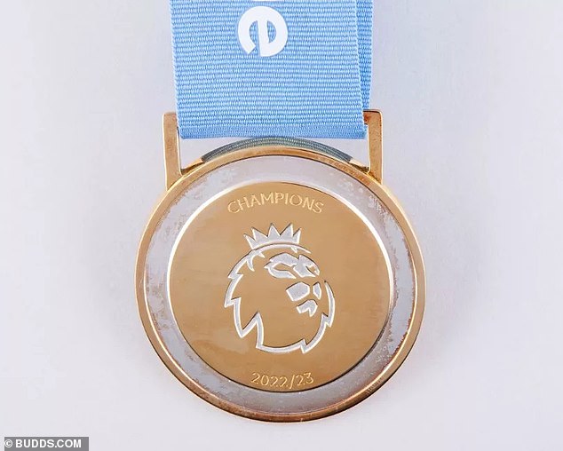 The Premier League medal includes the inscription 'Champions 2022-23' and a ribbon