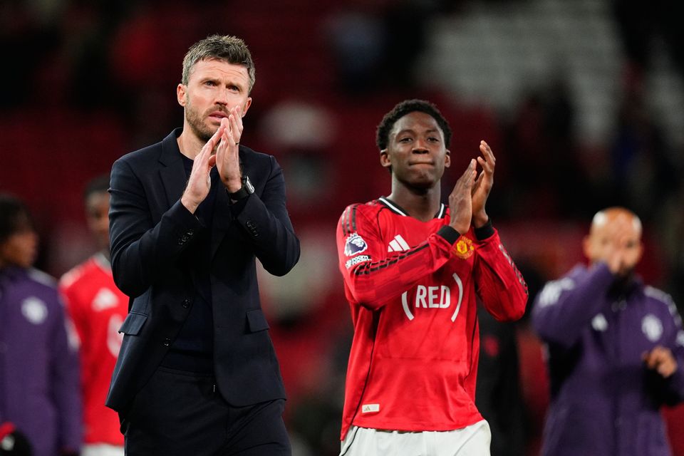 Manchester United manager Michael Carrick with Kobbie Mainoo after the Premier League victory over Brentford at Old Trafford. Photo: PA
