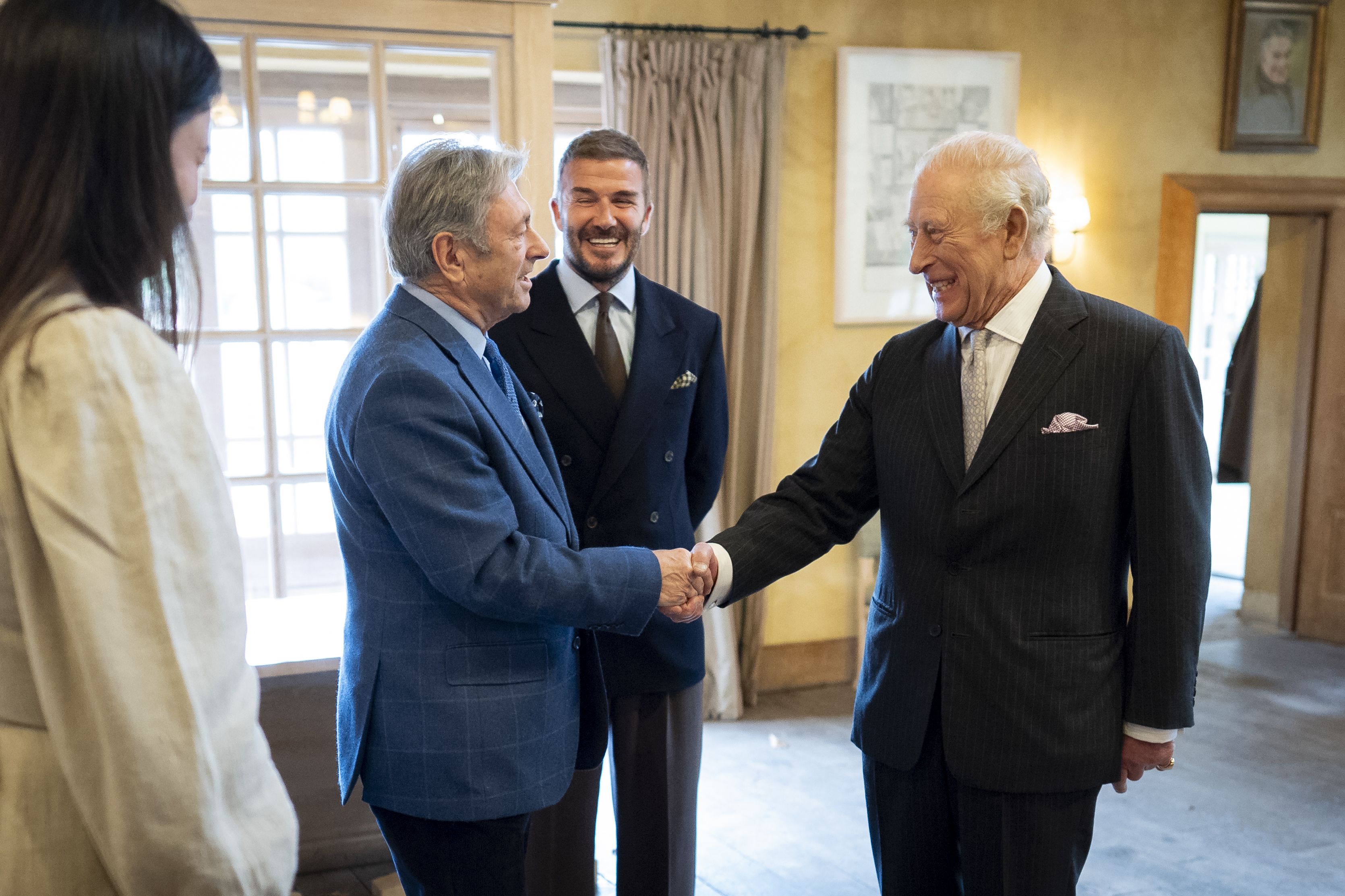 The King greeting Alan Titchmarsh, watched by Sir David Beckham, at Highgrove