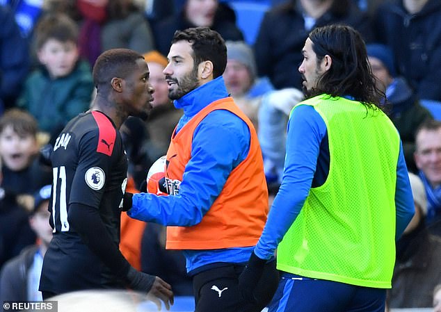 Wilfried Zaha confronts Ezequiel Schelotto (right) during a heated clash in 2020