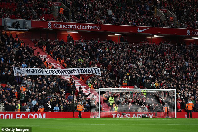 Liverpool fans hold up a banner which reads #Stop Exploiting Loyalty as they protest against the rising cost of tickets