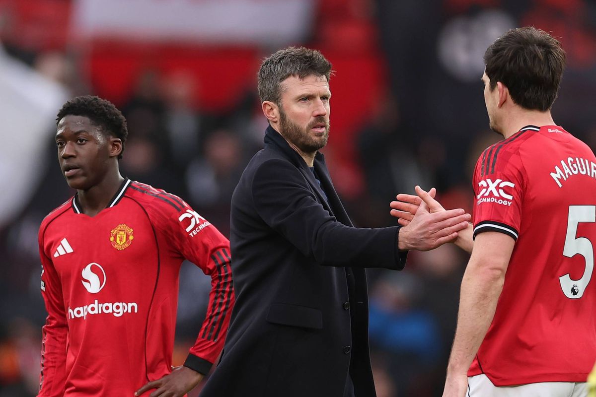 Michael Carrick Head Coach of Manchester United shakes hands with Harry Maguire after the Premier League match between Manchester United and Aston Villa at Old Trafford
