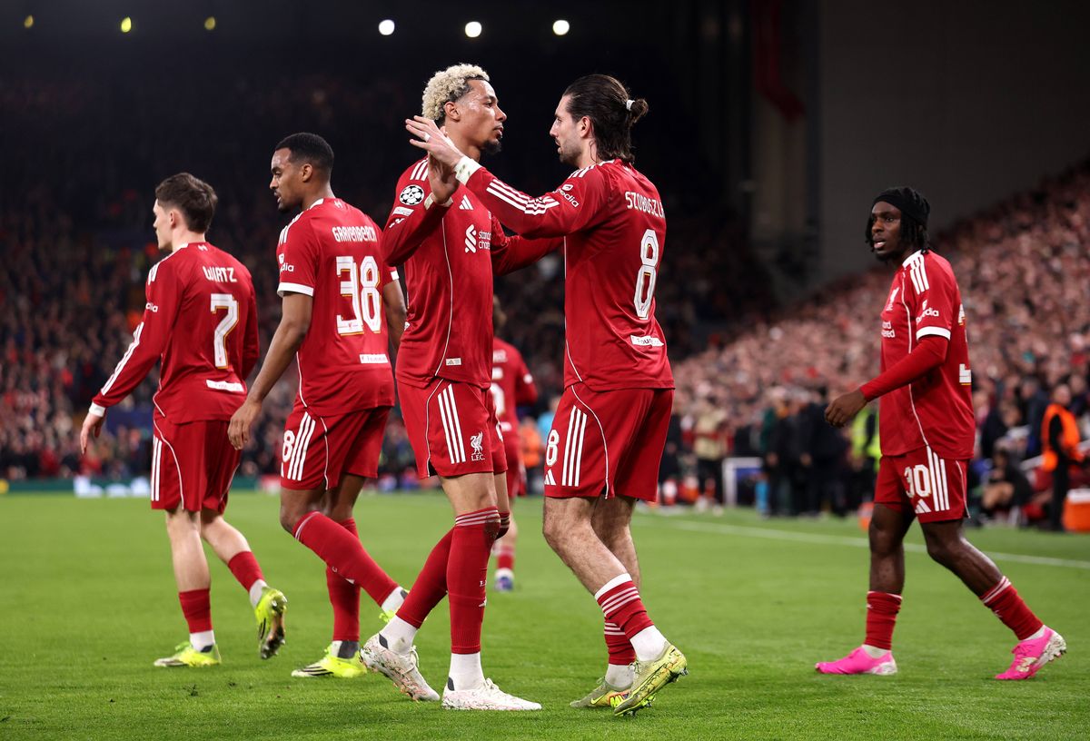 Dominik Szoboszlai of Liverpool celebrates scoring his team's first goal with teammate Hugo Ekitike during the UEFA Champions League 2025/26 Round of 16 Second Leg match between Liverpool FC and Galatasaray