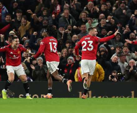 Manchester United's Patrick Dorgu celebrates scoring their first goal with Manchester United's Diogo Dalot, Manchester United's Luke Shaw and Manchester United's Manuel Ugarte