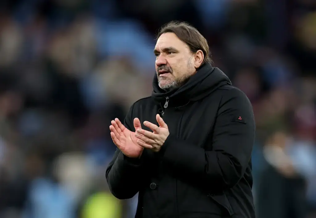 Daniel Farke claps the Leeds United fans on the pitch at the end of a game