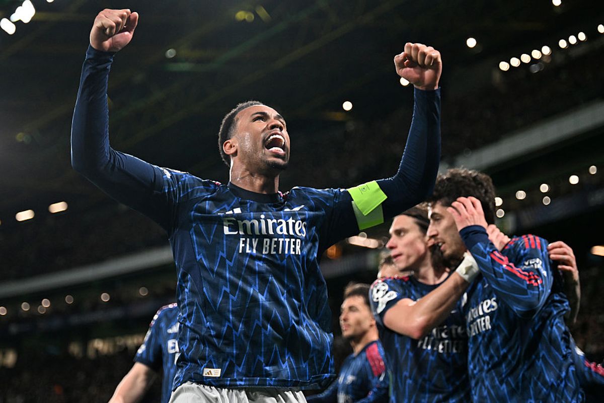 Arsenal celebrate their late winner vs Sporting