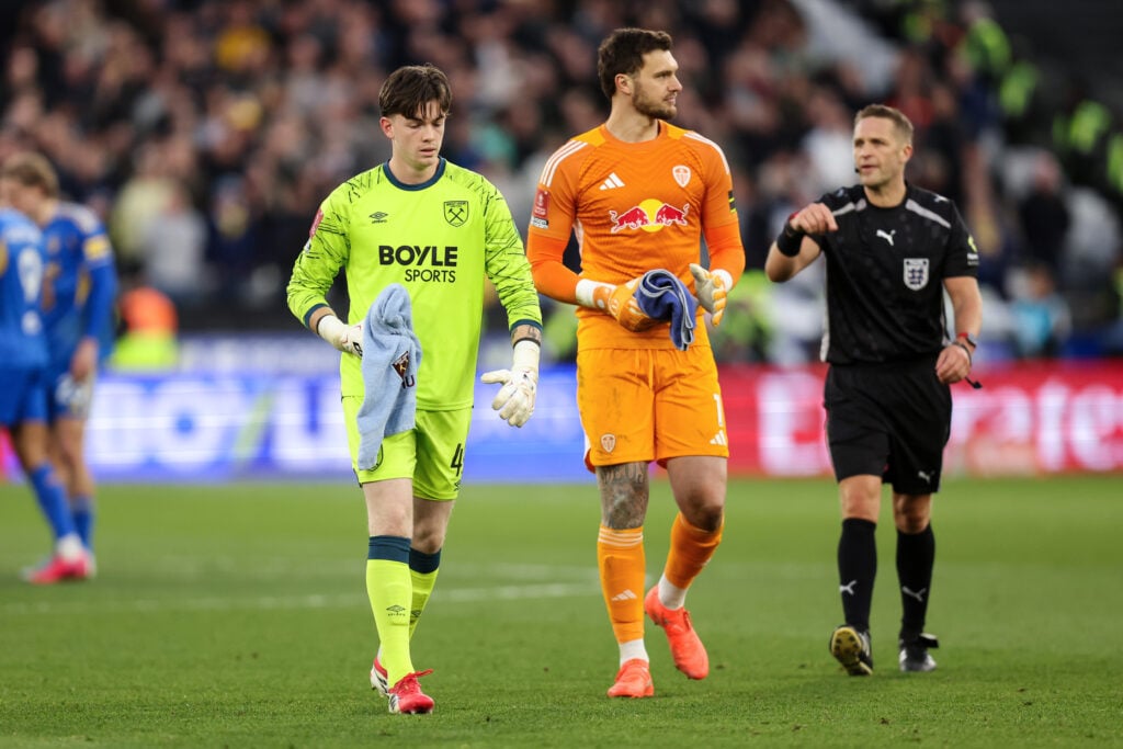 Finlay Herrick of West Ham United and Leeds United goalkeeper Lucas Perri during the Emirates FA Cup Quarter Final match between West Ham and Leeds
