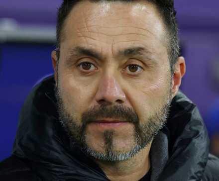Roberto De Zerbi looks out from the dugout