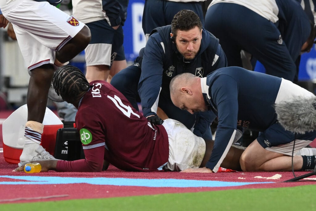 Axel Disasi of West Ham United receives medical treatment