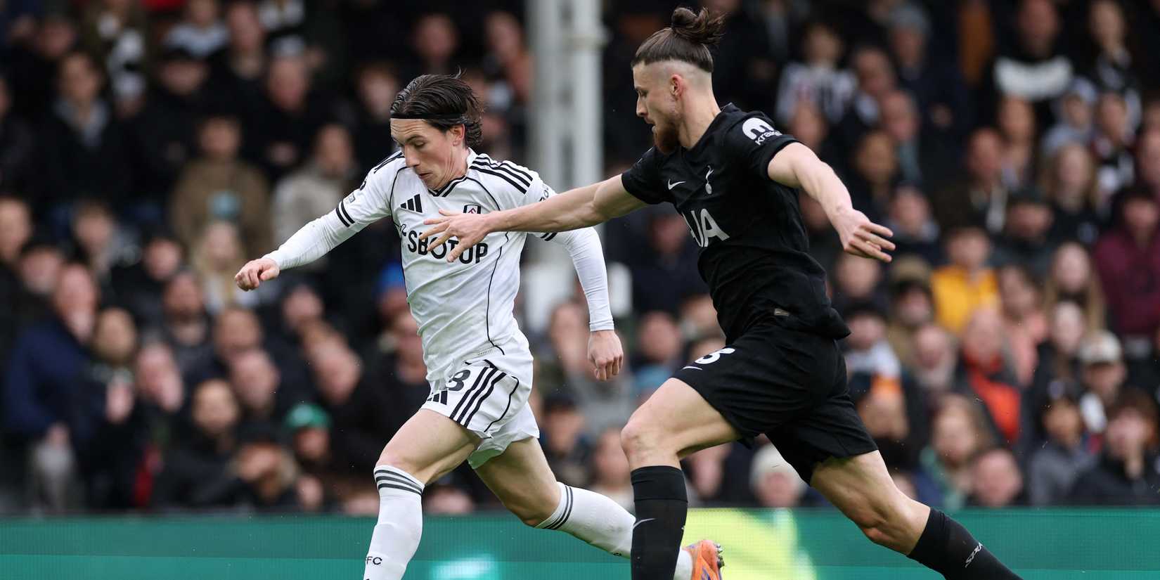 Fulham's Harry Wilson in action with Tottenham Hotspur's Radu Dragusin
