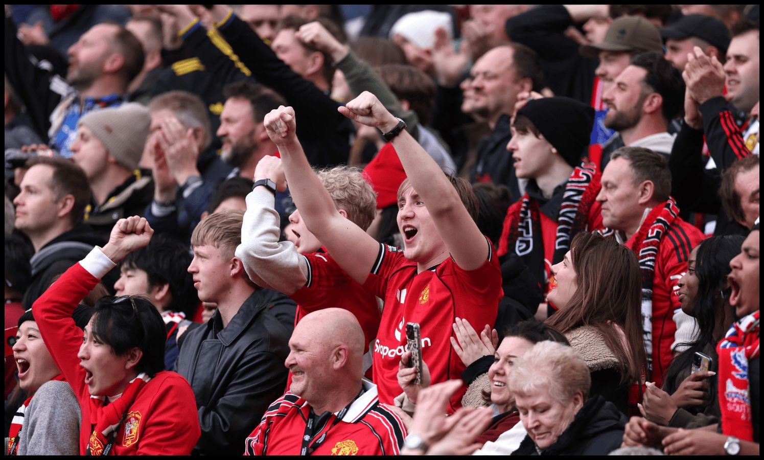 MANCHESTER, ENGLAND - MARCH 01: Fans of Manchester United celebrate their side's first goal scored by Bruno Fernandes of Manchester United (not pictured) during the Premier League match between Manchester United and Crystal Palace at Old Trafford on March 01, 2026 in Manchester, England.