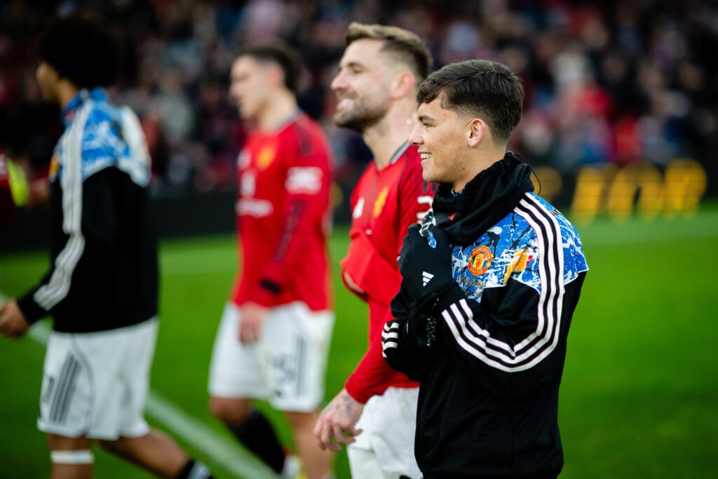 Shea Lacey walking off the pitch after Man Utd play Fulham