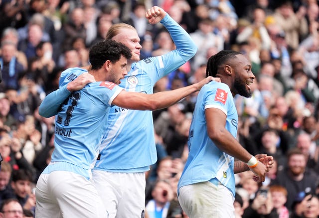 Manchester City’s Erling Haaland celebrates scoring a goal with team-mates