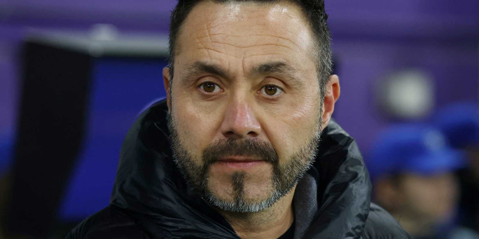 Roberto De Zerbi looks out from the dugout