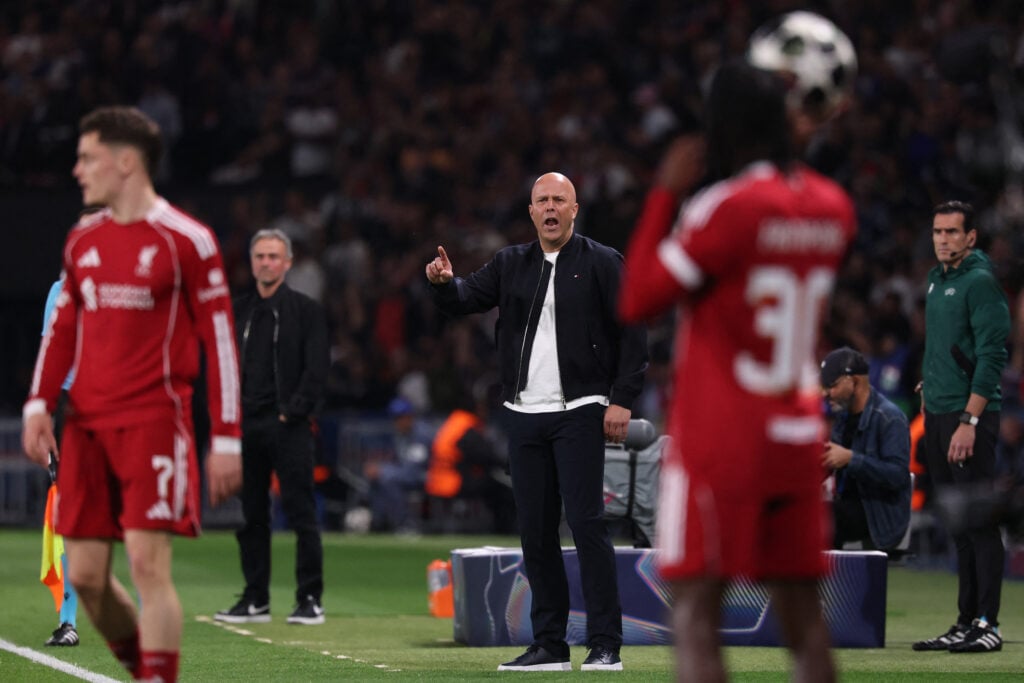 Jeremie Frimpong takes throw-in for Liverpool in front of Arne Slot