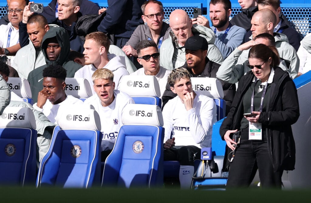 Enzo Fernandez of Chelsea looks on from the bench
