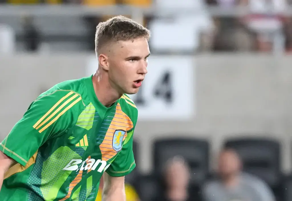 Aston Villa goalkeeper Oliwier Zych gets ready to kick the ball